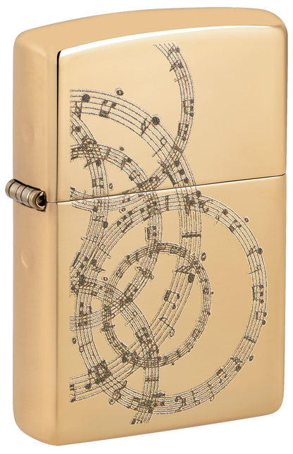 Gold Zippo lighter with intricate music sheet design P1