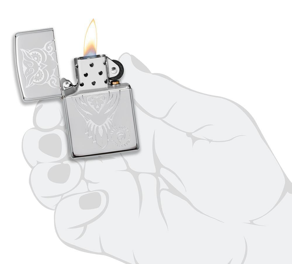 Anne Stokes Owl design High Polish Chrome windproof lighter lit in hand