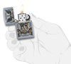 Zippo aansteker chroom Odin met helm geopend met vlam in gestileerde hand