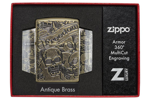 Zippo-aansteker antiek messing met diep gegraveerde doodshoofden in open luxe verpakking